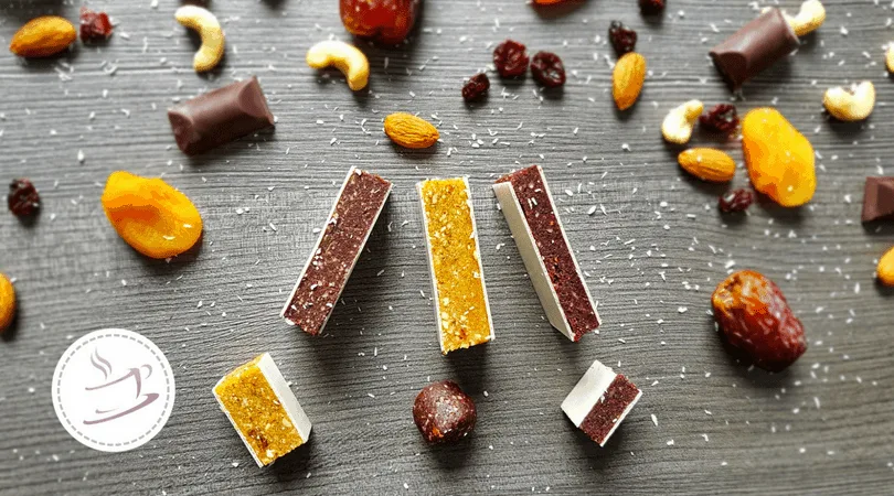 fruit bars and ingredients on a wooden plate