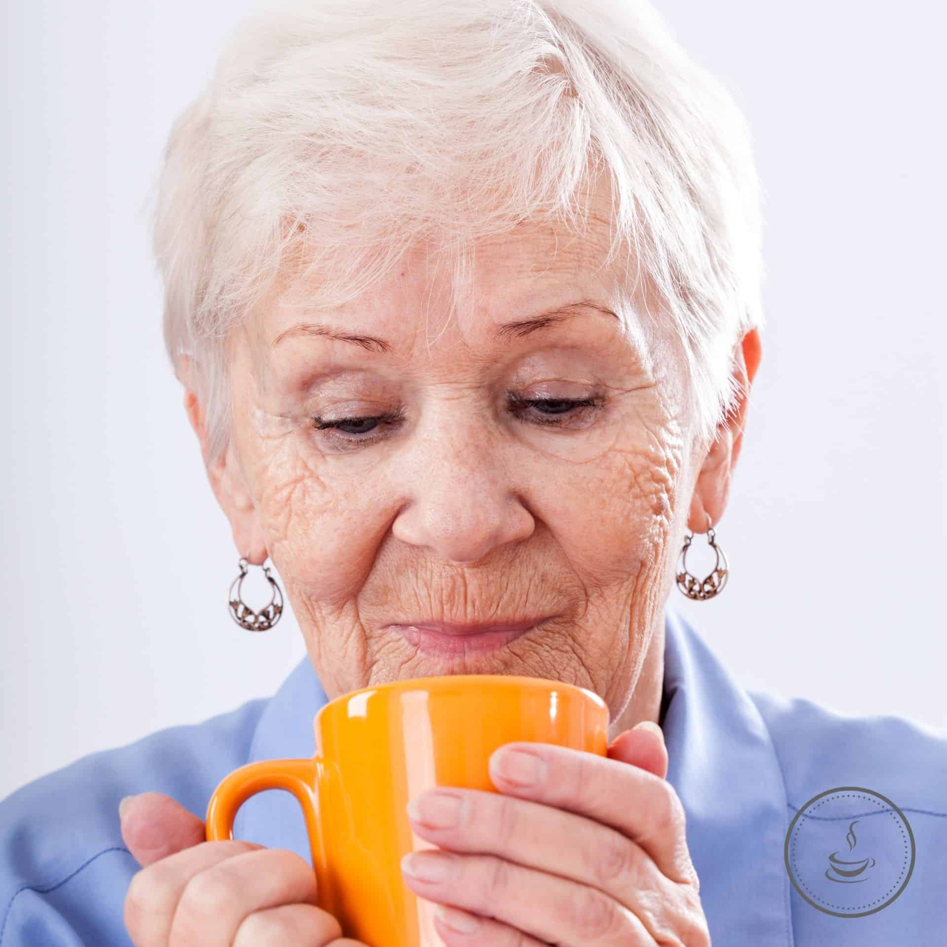 Grandma drinking a hot beverage